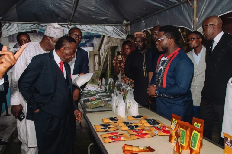 An official views a display of Mumita Foods products during the MINESUP visit