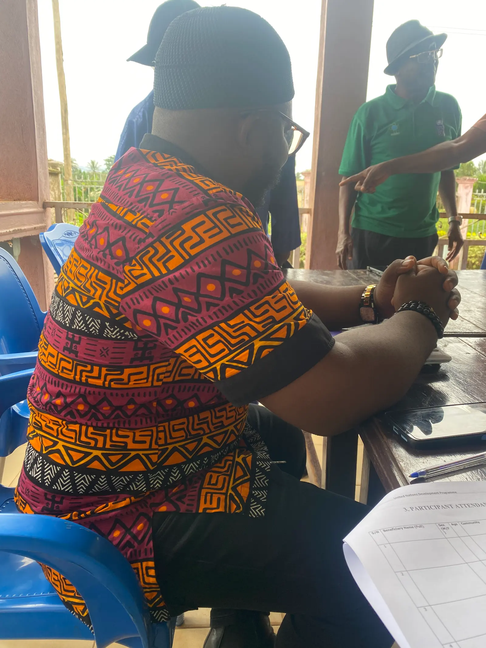 A meeting with farmers on a veranda