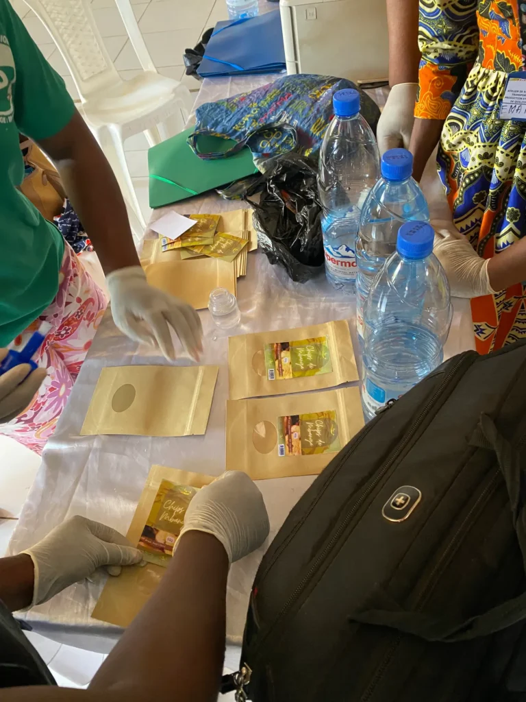 Gloved hands seal kraft pouches
