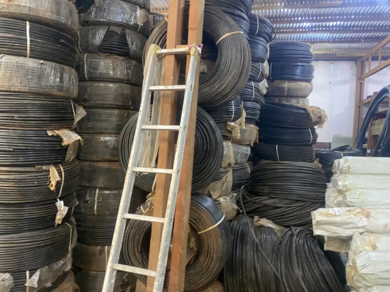 Irrigation pipe coils stacked high in the warehouse