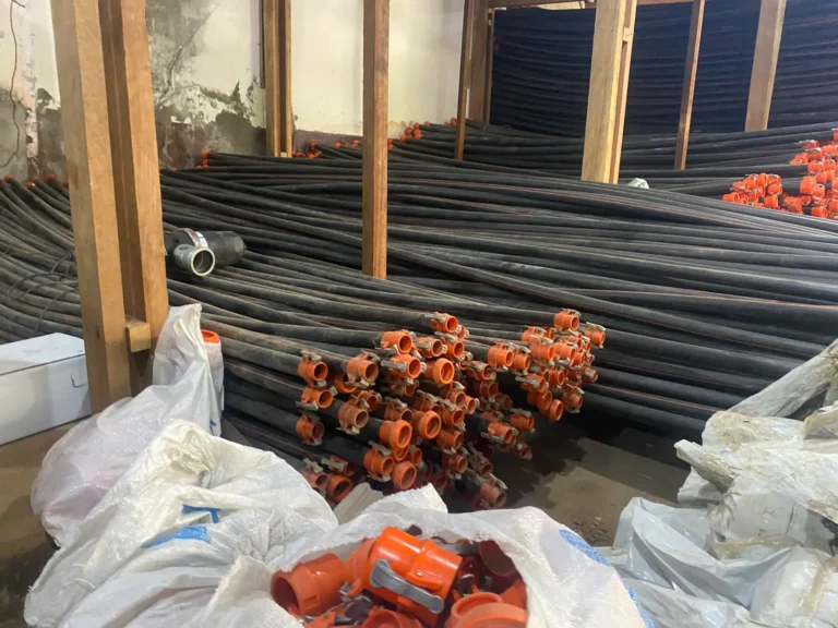 Irrigation pipe and fittings stored in the shed