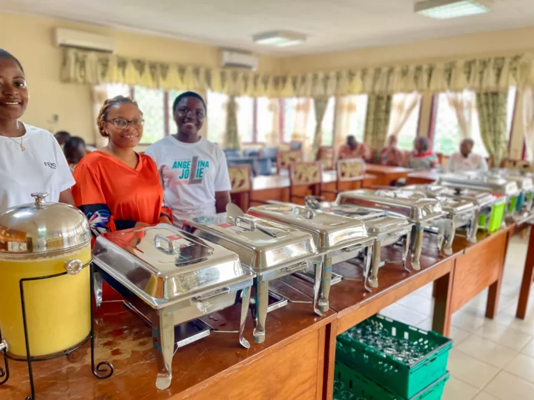 Praïs catering staff behind the buffet
