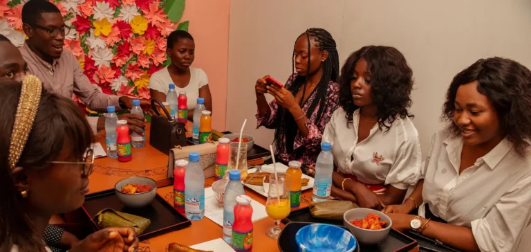 Diners share plates of food and juices at the Praïs restaurant