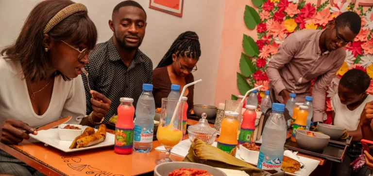 Diners eat leaf-wrapped dishes and stew at the restaurant