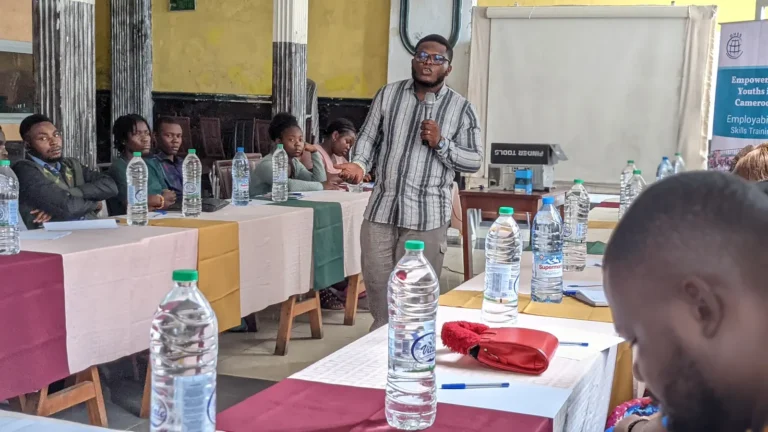 A trainer addresses a youth workshop