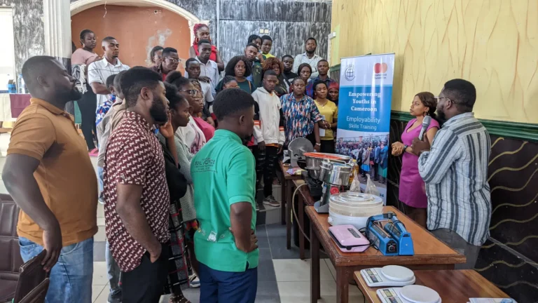 Young people gather round an equipment demonstration
