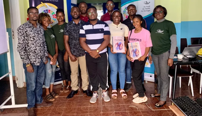 Snail-farming trainees gather for a group photo
